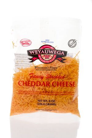Winneconne, WI - 21 July 2019 : A package of Weyauwega shredded cheddar cheese on an isolated...