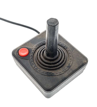Winneconne,  WI - 5 May 2020:  A package of Atari 2600 joystick controller covered with dust on an isolated backgroundのeditorial素材