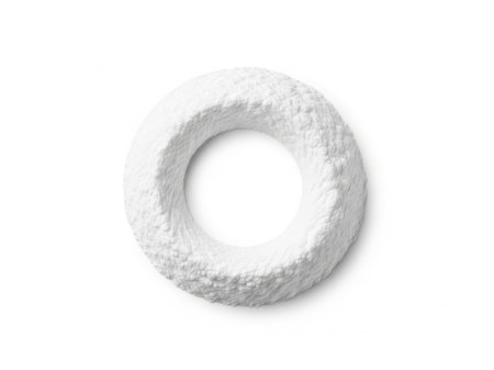 The image features a single, pristine white doughnut placed centrally against a plain, unblemished white background. The doughnut has a smooth, slightly textured surface and a perfectly round hole in the center. The simplicity of the image draws attention to the doughnut's shape and texture, creating a sense of calm and minimalism.の素材