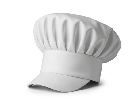 The image features a pristine white chef hat, also known as a toque, isolated against a plain white background. The hat is designed with a classic pleated style, featuring a wide brim that extends outward. The material appears to be clean and crisp, suggesting it is new and unused. The chef hat is a symbol of culinary professionals and is often associated with gourmet cuisine and the art of cooking.の素材