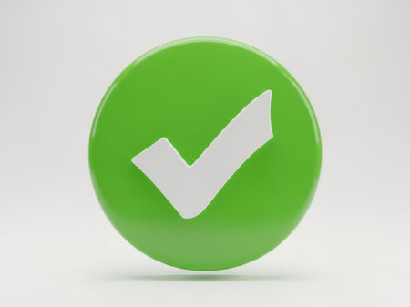 The image features a vibrant green circle with a prominent white checkmark in the center. The checkmark is slightly tilted to the right, giving it a dynamic feel. The green circle has a glossy finish, creating a subtle shadow beneath it, which adds depth to the overall composition. The simplicity and use of contrasting colors make the image visually striking.の素材