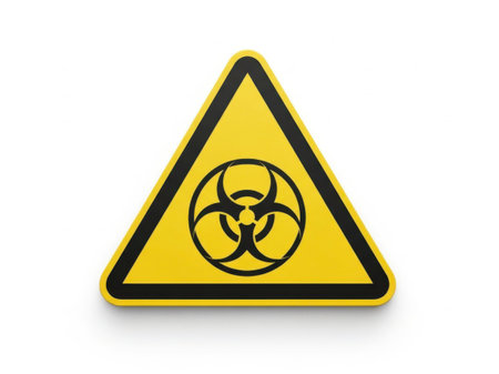 The image depicts a universally recognized warning sign indicating a biological hazard. The sign is triangular in shape with a yellow background and a black border. Inside the triangle, there is a black symbol consisting of three interconnected lines forming a figure resembling a stylized biological agent. This sign is used to alert individuals to the presence of hazardous biological materials that could pose a risk to health and safety. Such signs are commonly found in laboratories, hospitals, and other environments where biological hazards may be present.の素材