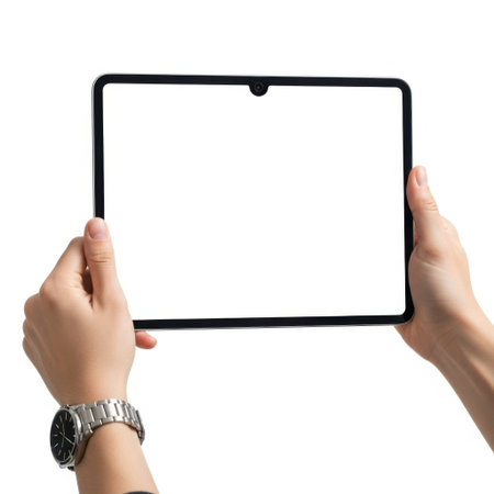 The image depicts a pair of hands holding a tablet device against a plain white background. The tablet screen is blank, and the hands are positioned on either side of the device. One hand is adorned with a wristwatch featuring a silver band and a black face with white markings. The overall setting is minimalistic, focusing solely on the interaction between the hands and the tablet.の素材