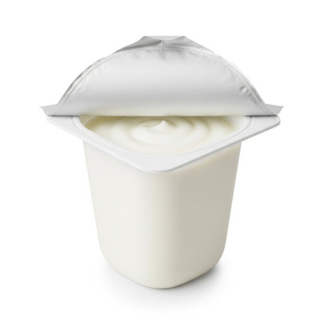 This image features a single serving of yogurt in a white plastic cup, with a white lid partially removed. The yogurt is smooth and creamy, and the cup is placed against a white background. The image is clear and SEO-friendly, highlighting the simplicity and freshness of the yogurt.の素材