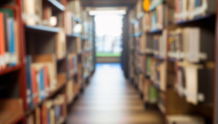 Blurred image of bookshelves in library for background usage.の写真素材