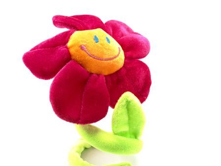 Happy smiling flower toy isolated on white backgroundの写真素材