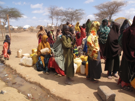 Dadaab, Somalia-August 15,2011: Woman & children live in the Dadaab refugee camp where thousands of Somalis wait for help because of hunger  in Dadaab, Somalia. のeditorial素材