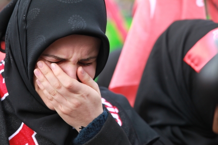 Istanbul, Turkey - November 24, 2012 : Shiite mourners offer afternoon prayer during Chehlum...