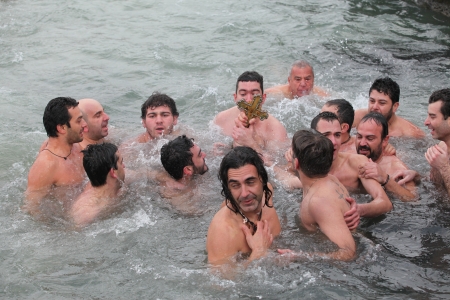 Istanbul,Turkey-January 6, 2012: Orthodox Christians in Istanbul reenacted the baptism of Christ with a traditional cross-throwing ceremony on January 6, 2012 in istanbul,Turkeyのeditorial素材