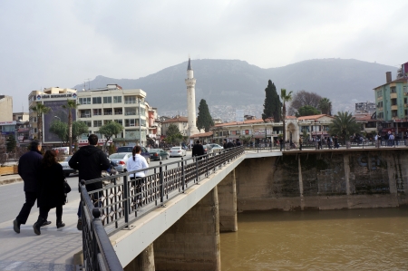   Antakya, Turkey - January 26, 2013: People use a pedestrian bridge to cross the Orontes River (Turkish: Asi Nehri) in downtown Antakya.                                                         のeditorial素材