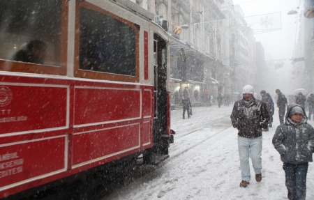ISTANBUL,TURKEY-JANUARY 8: Unidentified pedestrians walk down Istiklal Street on a snowy day on January 8, 2013 in Istanbul, Turkey.Istiklal Street is one of the popular destinations in Istanbul.のeditorial素材