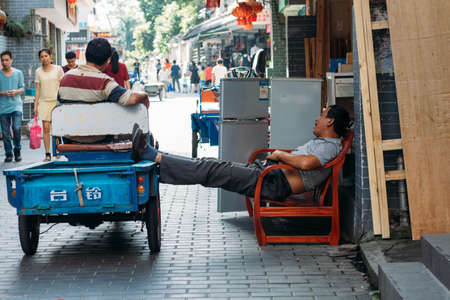 Two men chatting on the streetのeditorial素材