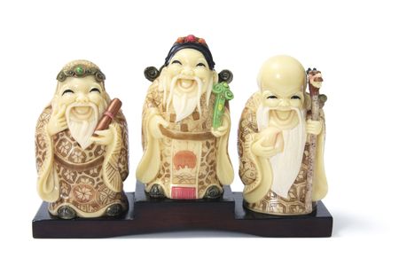 Three Star God Figurines on White Backgroundの写真素材