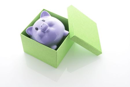 Piggy Bank in Box with Reflectionの写真素材