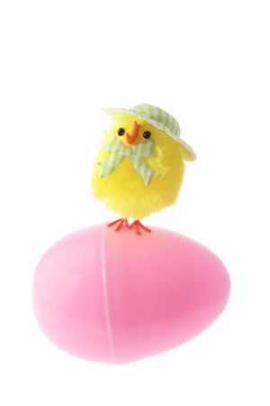 Toy Chick on Easter Egg on White Background