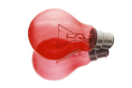 Red Light Bulb with Reflection on White Backgroundの写真素材