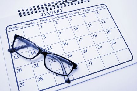 Calendar and Eyeglasses in Blue Toneの写真素材