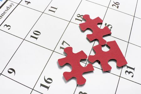 REd Jigsaw Puzzle Pieces on Calendar