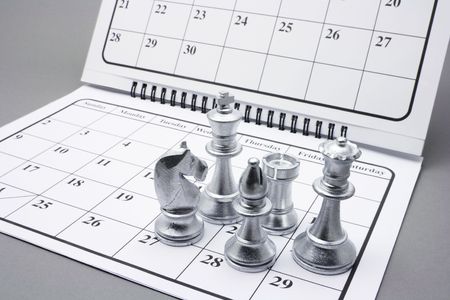 Chess Pieces on Calendar with Grey Backgroundの写真素材