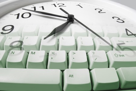 Composite of Clock and Computer Keyboard の写真素材