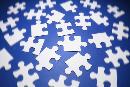 Jigsaw Puzzle Pieces on Blue Background