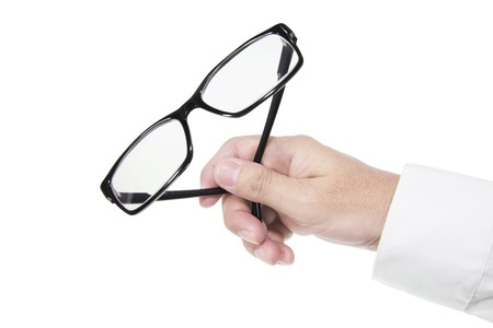 Hand Holding Eyeglasses on Isolated White Backgroundの写真素材