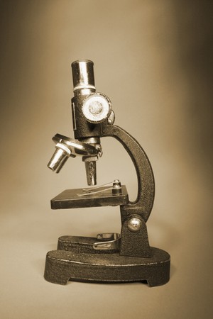 Microscope in Warm Tone on Seamless Backgroundの写真素材