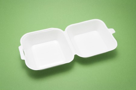 Polystyrene Food Box on Green Backgroundの写真素材