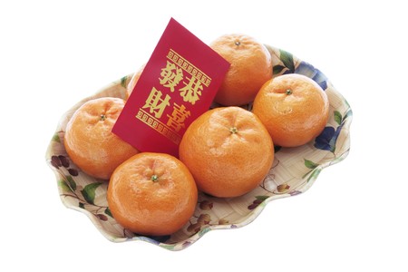 Mandarins and Red Packet on white Backgroundの写真素材