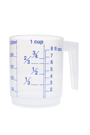 Plastic Measuring Cup on White Backgroundの写真素材