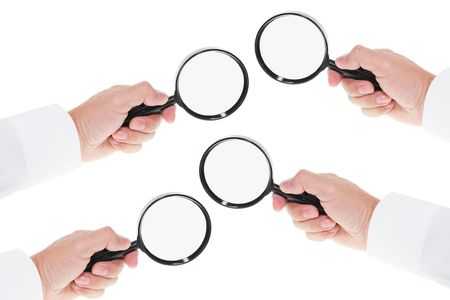 Hands Holding  Magnifying Glass on Seamless White Backgroundの写真素材