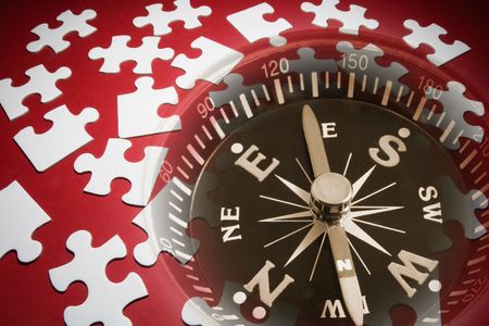 Composite of Jigsaw Puzzle Pieces and Compassの写真素材