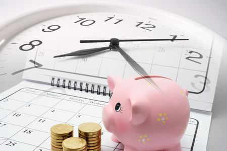 Piggy Bank and Coins on Calendar with Grey Background