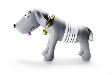 Plastic Dog Figurine on White Backgroundの写真素材