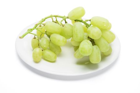 Plate of Green Grapes on White Backgroundの写真素材
