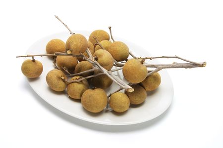 Plate of Fresh Longans on White Backgroundの写真素材