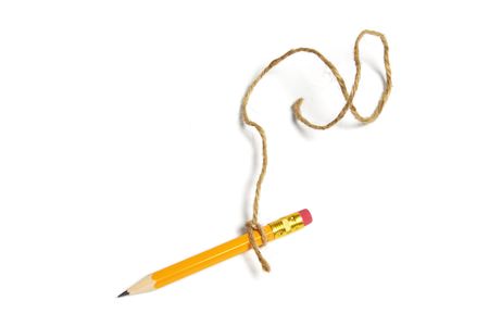 Pencil Tied with String on White Backgroundの写真素材
