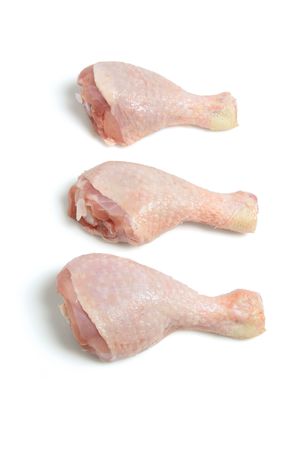 Raw Chicken Drumsticks on White Backgroundの写真素材