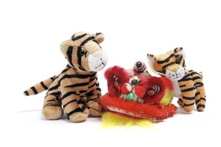Soft Toy Tigers and Lion Dancing Head on White Backgroundの写真素材