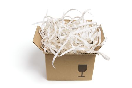 Box of Paper Shreddings on White Backgroundの写真素材