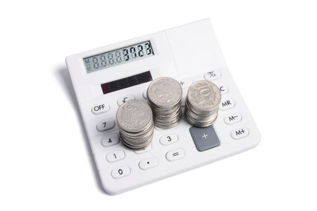 Calculator and Coins on White Backgroundの写真素材