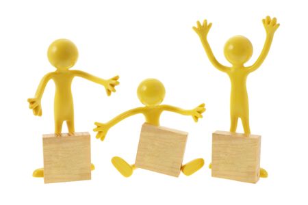 Rubber Figures with Wooden Blocks on White Backgroundの写真素材