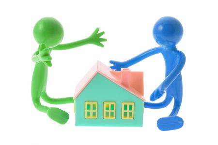Rubber Figures with Toy House on White Backgroundの写真素材