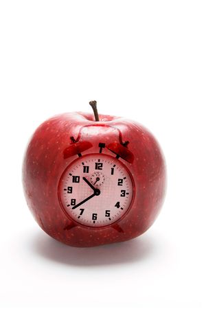 Composite of Apple and Clock on White Backgroundの写真素材