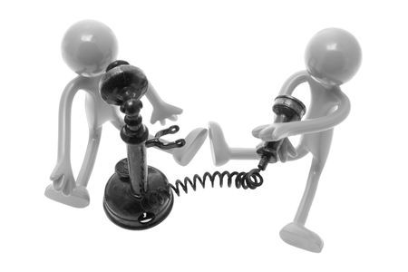 Rubber Figures with Antique Phones on White Backgroundの写真素材