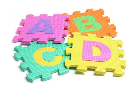 Alphabet Puzzle Pieces on White Backgroundの写真素材