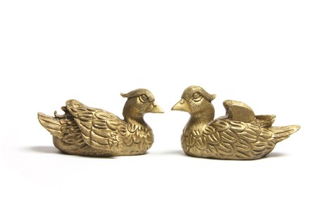 Mandarin Duck Figurines on White Backgroundの写真素材