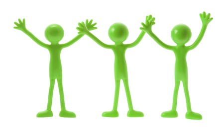 Green Rubber Figures with Hands Up on White Backgroundの写真素材