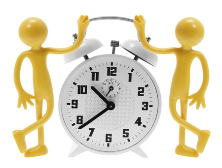 Alarm Clock and Miniature Figures on White Backgroundの写真素材