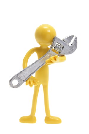 Miniature Figure Holding Spanner on White Backgroundの写真素材